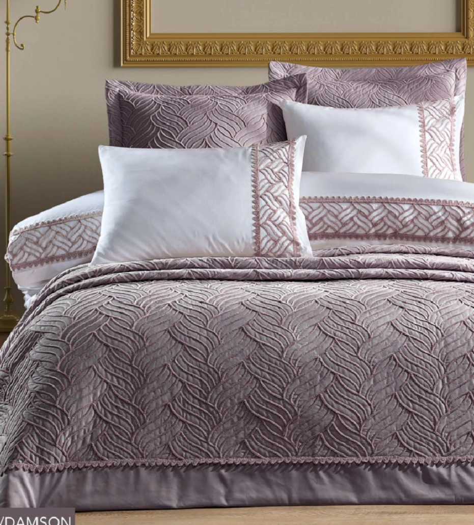 A luxurious bedroom featuring the Cloud Sensation Hybrid Mattress by EA-Simmons, styled with premium bedding.